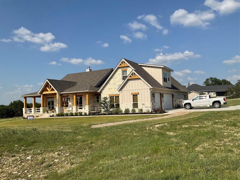 Front exterior of a new home in , Liberty Hill, TX, highlighting curb appeal (Image 18).