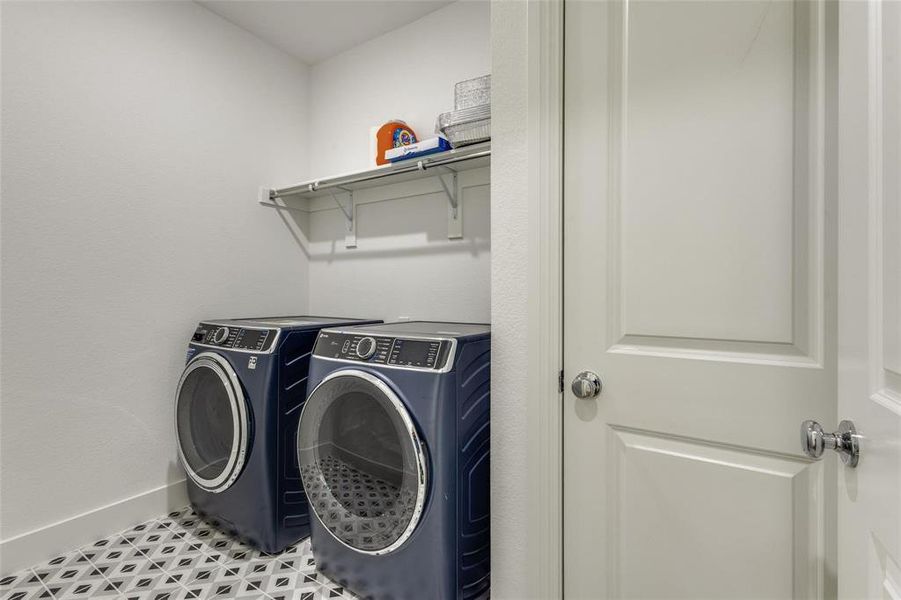 Laundry room with baseboards and separate washer and dryer Laundry room with baseboards and separate washer and dryer