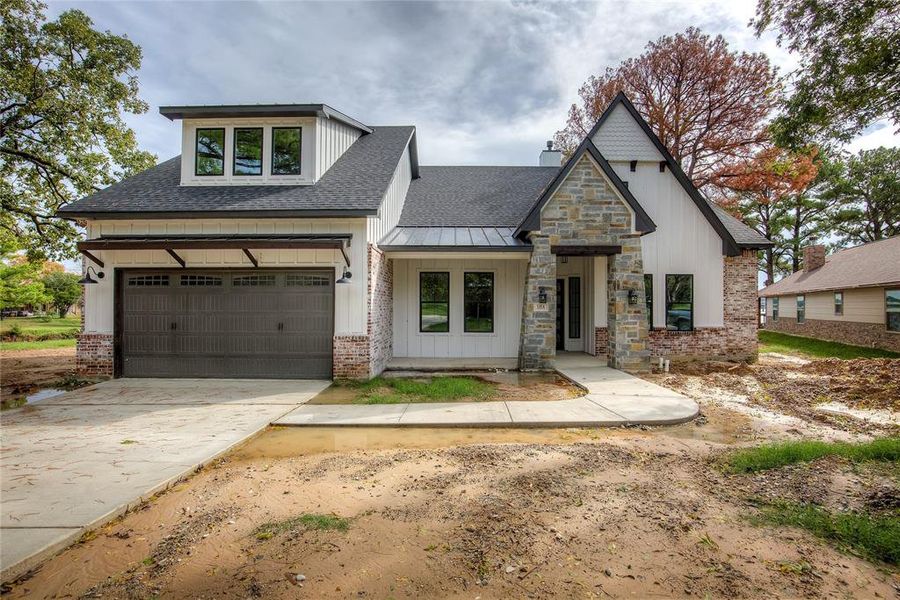 Front exterior of a new home in , Gun Barrel City, TX, highlighting curb appeal (Image 2). Front exterior of a new home in , Gun Barrel City, TX, highlighting curb appeal (Image 2).