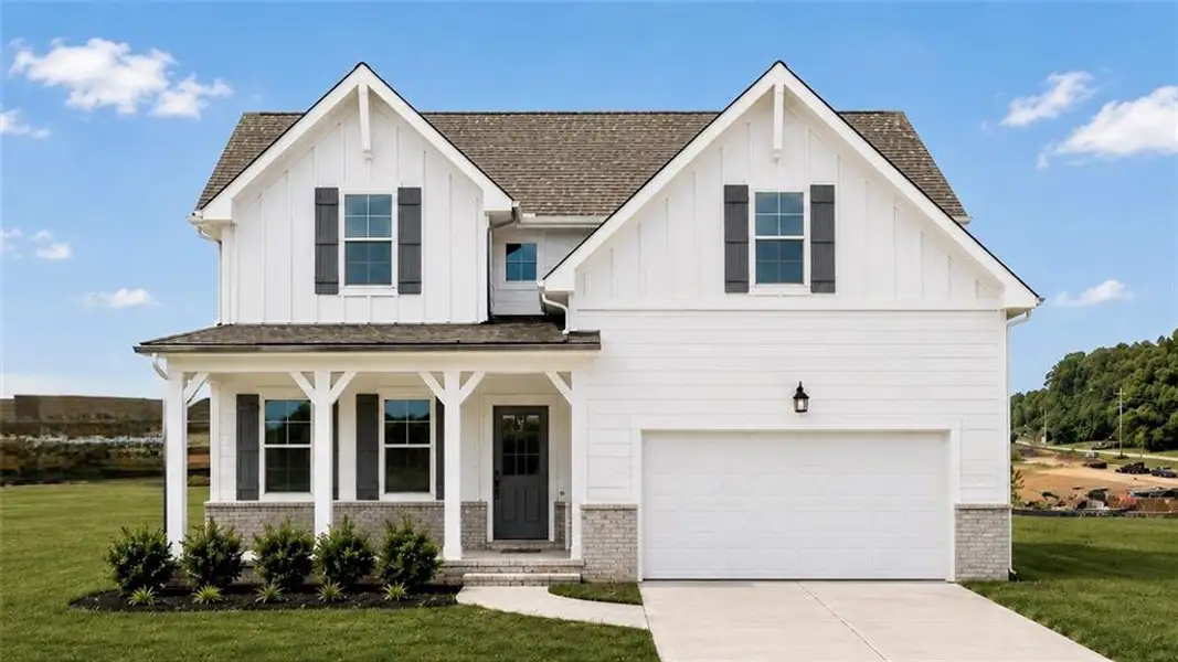 Front exterior of a new home in Wehunt Meadows, Hoschton, GA, highlighting curb appeal (Image 2). Front exterior of a new home in Wehunt Meadows, Hoschton, GA, highlighting curb appeal (Image 2).