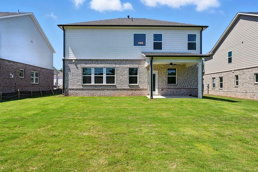 Front exterior of a new home in Bennett Farm, Loganville, GA, highlighting curb appeal (Image 1).