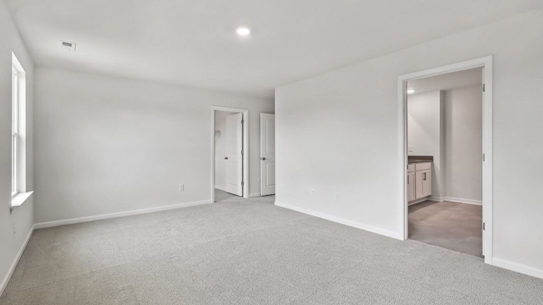 Representative unfurnished interior of a home built from the Robie by D.R. Horton in The Grove at Matthews Landing, Fuquay Varina (Image 22).