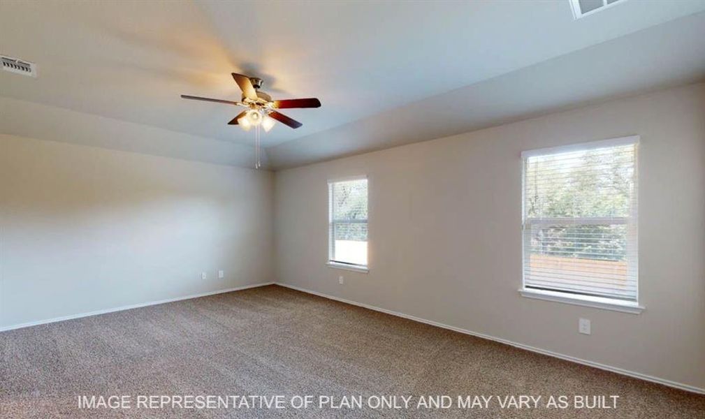 Spacious room featuring carpeting, two windows with blinds, a ceiling fan with integrated lighting, and neutral wall paint Spacious room featuring carpeting, two windows with blinds, a ceiling fan with integrated lighting, and neutral wall paint