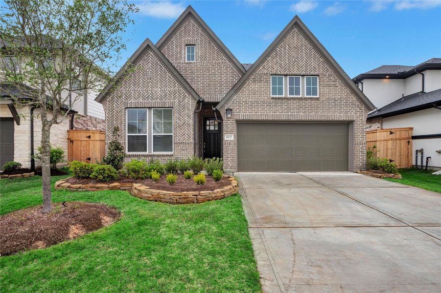 Front exterior of a new home in Cross Creek Ranch 45′, Fulshear, TX, highlighting curb appeal (Image 2).