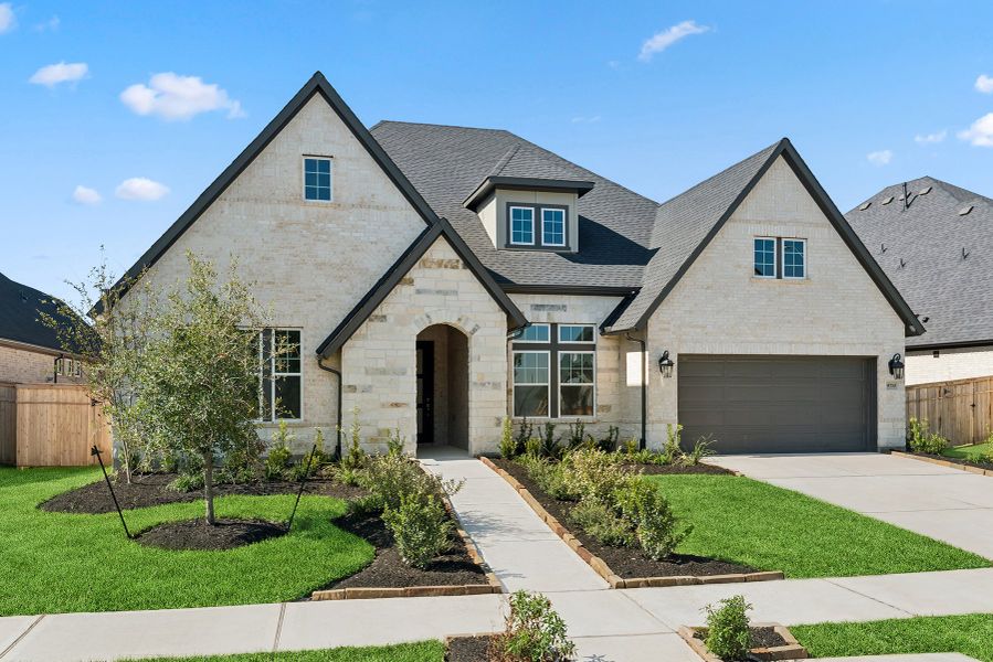 Front exterior of a new home in Sienna 65' Homesites, Missouri City, TX, highlighting curb appeal (Image 25).