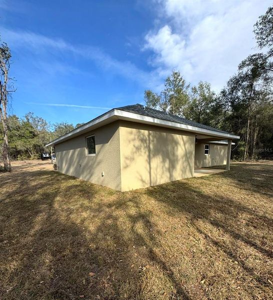 Exterior details and patio area of a home in , Citrus Springs (Image 3).