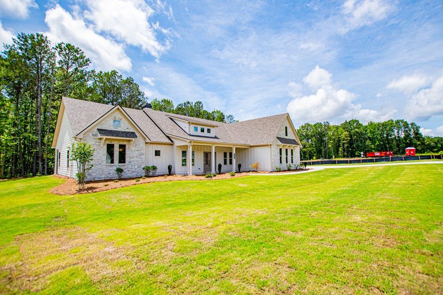 Exterior details and patio area of a home in WOODMONT RESERVE, Roopville (Image 39).