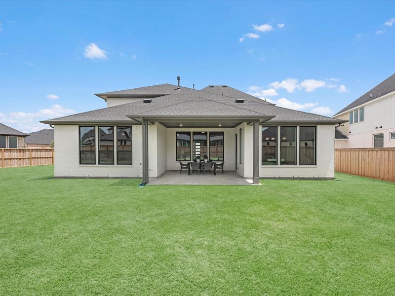 Exterior details and patio area of a home in Dunham Pointe, Cypress (Image 4).