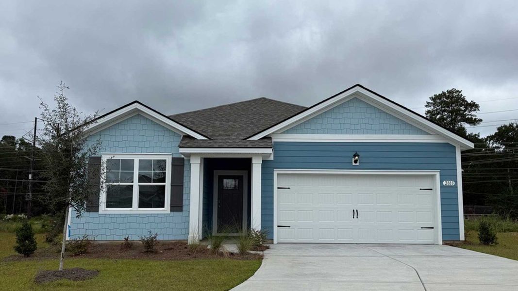 Front exterior of a new home in Kingston Bay, Conway, SC, highlighting curb appeal (Image 1). Front exterior of a new home in Kingston Bay, Conway, SC, highlighting curb appeal (Image 1).