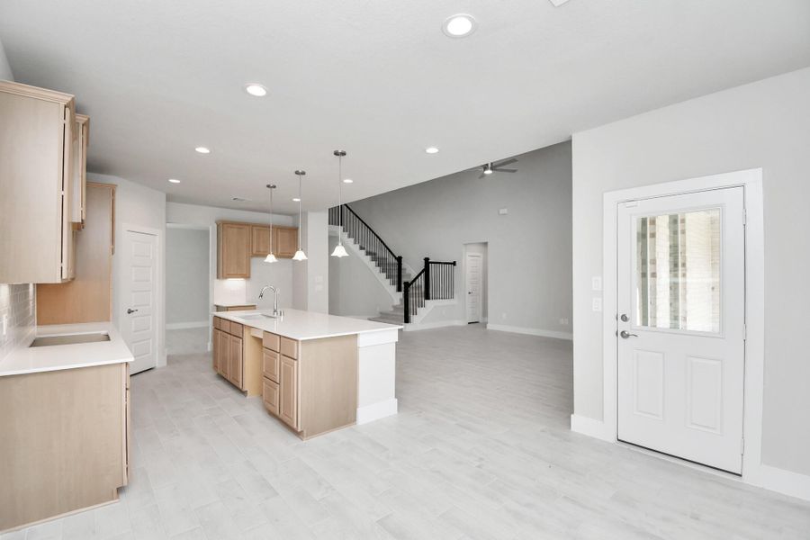 Enjoy breakfast with ease in the connected and cozy breakfast area, seamlessly integrated with the kitchen for utmost convenience. Step through the back door for a breath of fresh air onto the covered patio, extending your living space to the outdoors. Sample photo of completed home with similar floor plan. Actual colors and selections may vary. Enjoy breakfast with ease in the connected and cozy breakfast area, seamlessly integrated with the kitchen for utmost convenience. Step through the back door for a breath of fresh air onto the covered patio, extending your living space to the outdoors. Sample photo of completed home with similar floor plan. Actual colors and selections may vary.