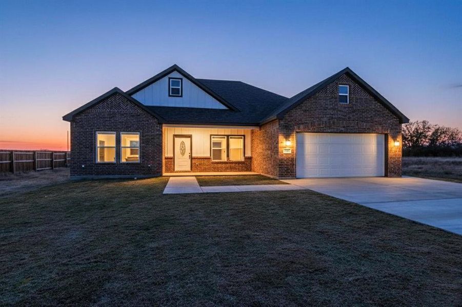 Front exterior of a new home in , Alma, TX, highlighting curb appeal (Image 2).