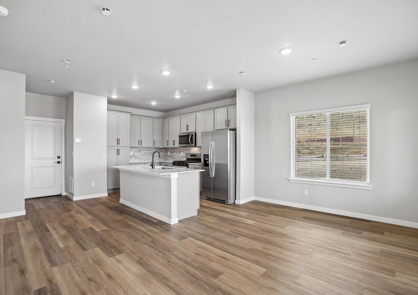 The second floor has another family room and is open to the kitchen.