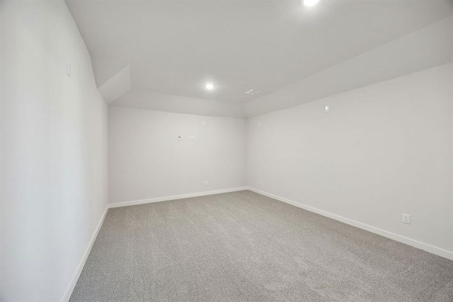 Media Room in the Wimbledon home plan by Trophy Signature Homes – REPRESENTATIVE PHOTO