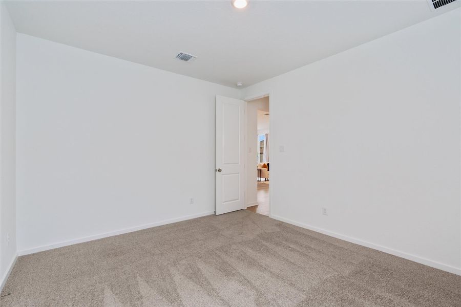 A spacious room offers ample potential, ready for personalization with neutral tones.
