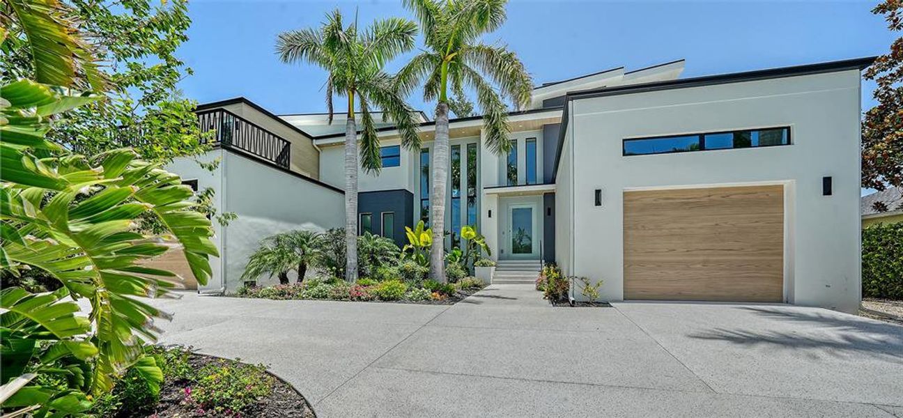 Front exterior of a new home in , Sarasota, FL, highlighting curb appeal (Image 32).
