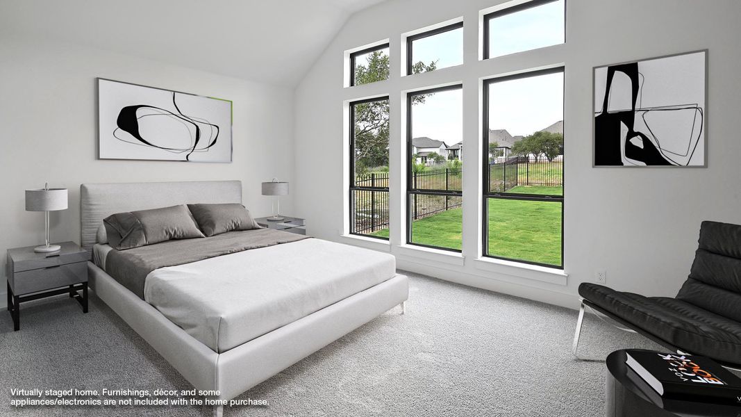 Carpeted bedroom with lofted ceiling Carpeted bedroom with lofted ceiling