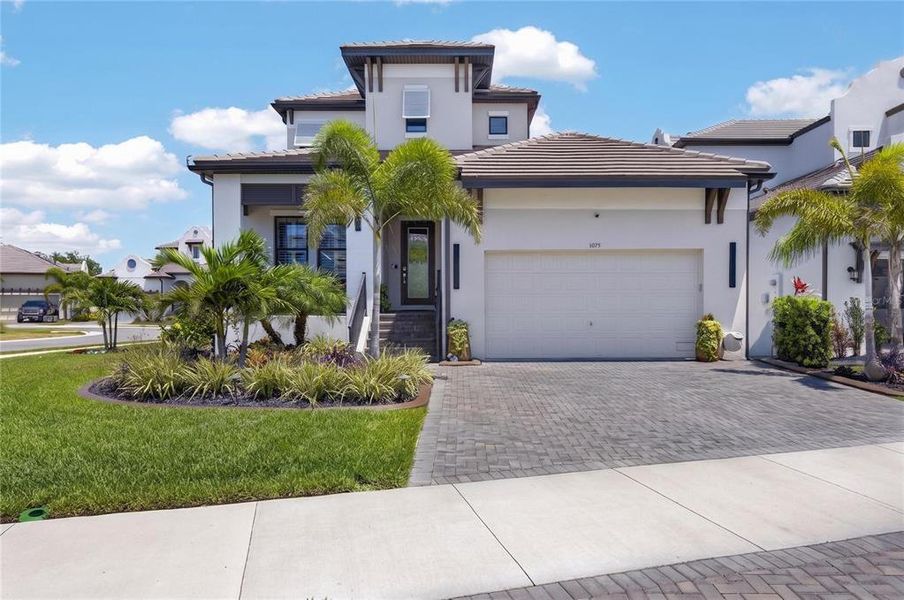 Front exterior of a new home in SouthShore Yacht Club, Ruskin, FL, highlighting curb appeal (Image 24).