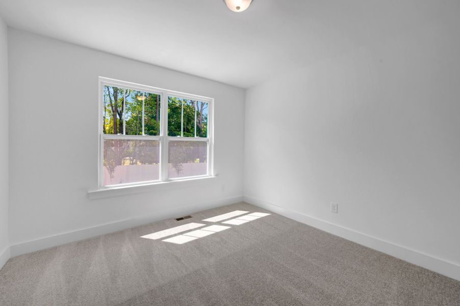 Spacious, unfurnished interior of a new home in Ashmore Townes, Garner (Image 25).