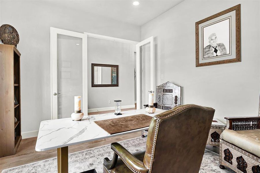 Office featuring light wood-style floors and recessed lighting
