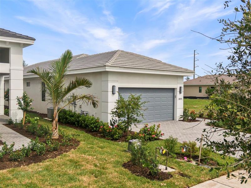 Front exterior of a new home in Cresswind Lakewood Ranch, Lakewood Ranch, FL, highlighting curb appeal (Image 20).