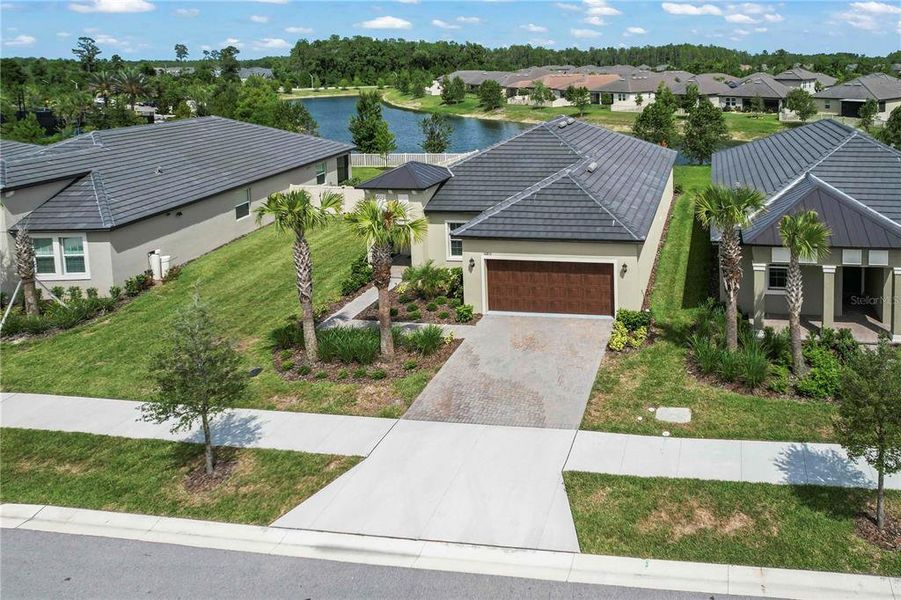 Front exterior of a new home in Angeline Active Adult, Land O' Lakes, FL, highlighting curb appeal (Image 2). Front exterior of a new home in Angeline Active Adult, Land O' Lakes, FL, highlighting curb appeal (Image 2).