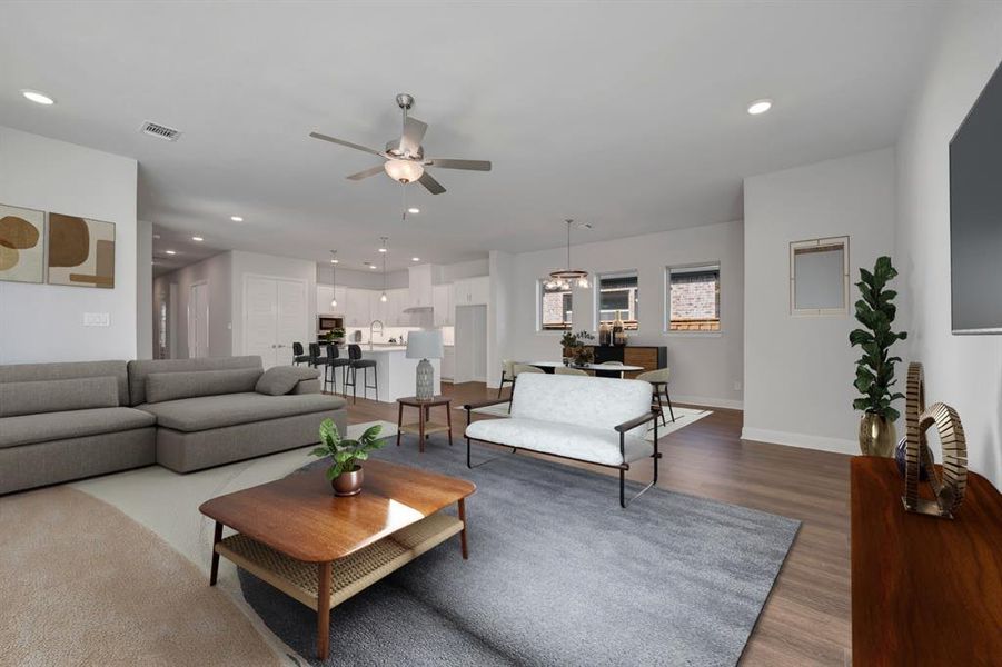 Living area featuring recessed lighting, a ceiling fan, and wood finished floors