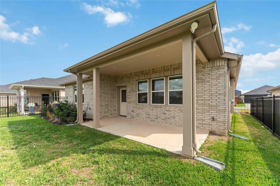 Exterior details and patio area of a home in Sunterra, Katy (Image 28). Exterior details and patio area of a home in Sunterra, Katy (Image 28).