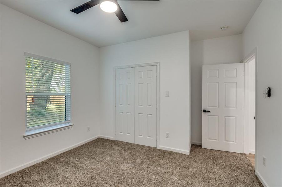 Unfurnished bedroom featuring carpet, a closet, and ceiling fan Unfurnished bedroom featuring carpet, a closet, and ceiling fan