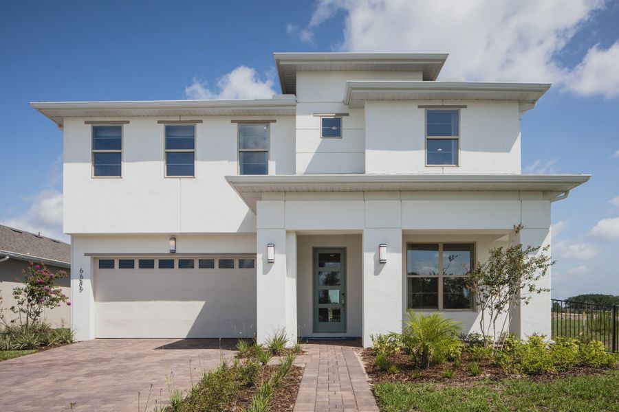 Representative exterior photo of a completed home built from the Tarpon II by Jones Homes USA in Reserve at Twin Lakes, St. Cloud, FL (Image 6).