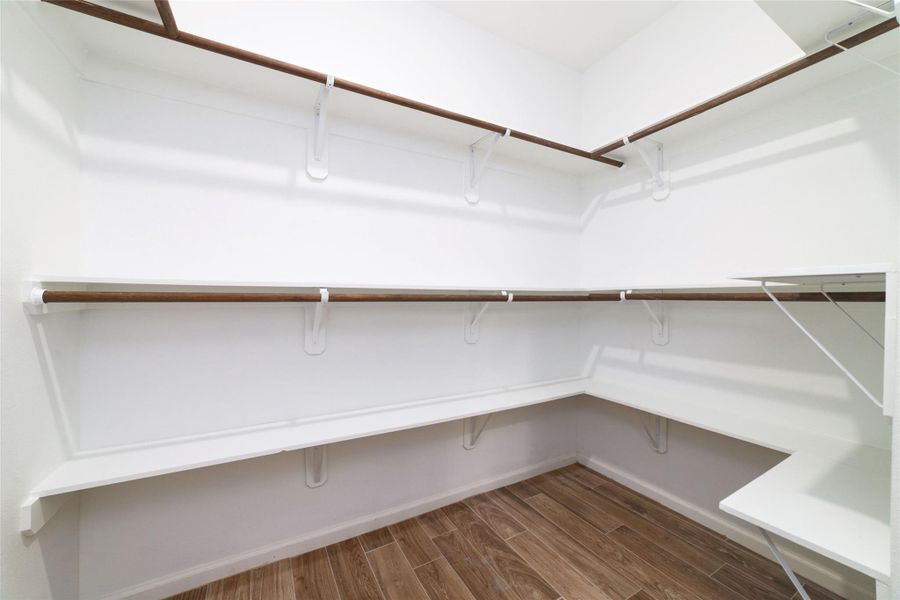 Second of TWO walk-in closets in the primary suite. Second of TWO walk-in closets in the primary suite.