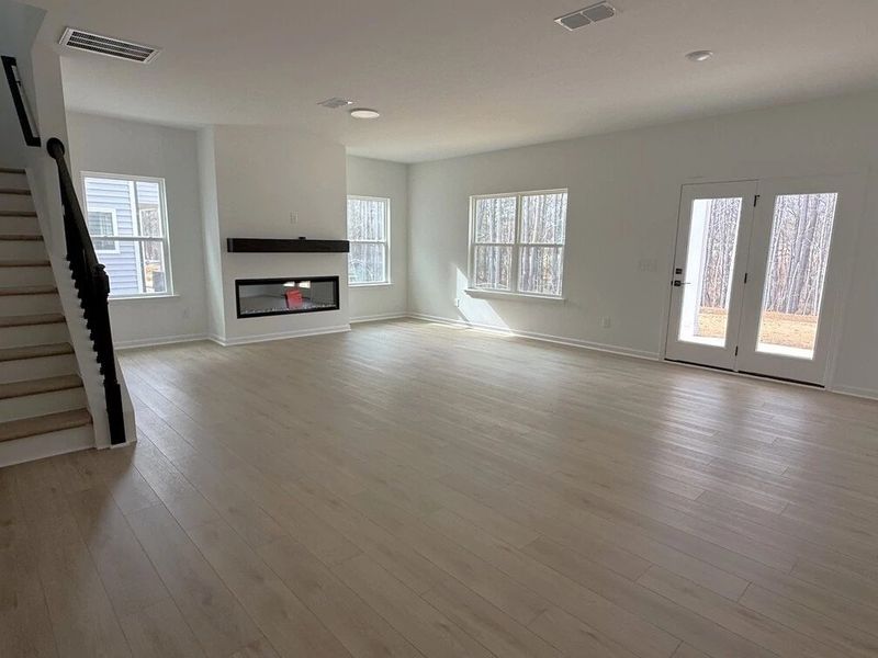 Family Room featuring the AW Collection® Serene - Open space with natural finishes and light. Family Room featuring the AW Collection® Serene - Open space with natural finishes and light.