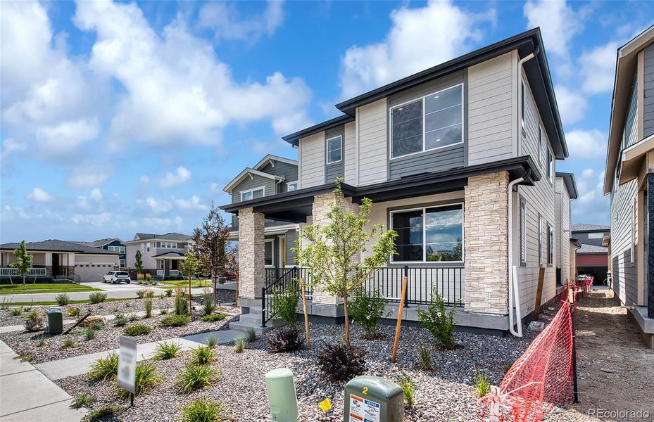 Front exterior of a new home in Painted Prairie, Aurora, CO, highlighting curb appeal (Image 15).