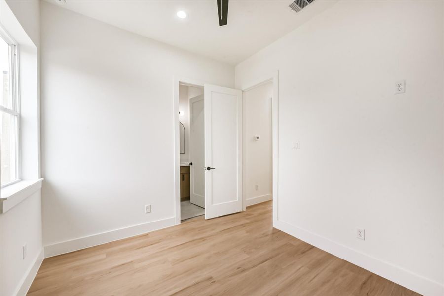 Back view of the bedroom showing the ensuite bathroom.