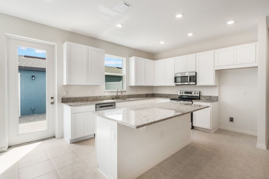Furnished interior view inside a new home in Eden Crest, Apopka (Image 6).