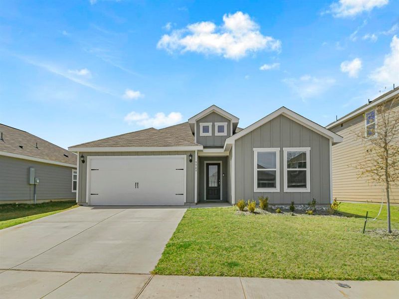 Front exterior of a new home in Retreat at Fossil Creek, Fort Worth, TX, highlighting curb appeal (Image 2). Front exterior of a new home in Retreat at Fossil Creek, Fort Worth, TX, highlighting curb appeal (Image 2).