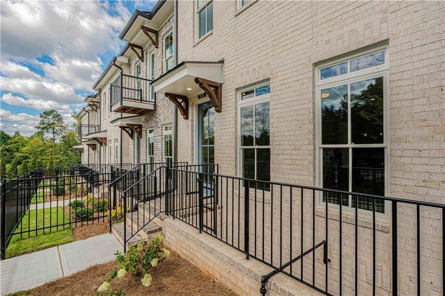 Exterior details and patio area of a home in Ward's Crossing Townhomes, Johns Creek (Image 27).