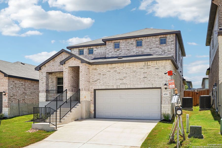 Front exterior of a new home in Comanche Ridge, San Antonio, TX, highlighting curb appeal (Image 22). Front exterior of a new home in Comanche Ridge, San Antonio, TX, highlighting curb appeal (Image 22).