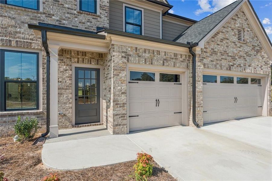 Front exterior of a new home in , Lawrenceville, GA, highlighting curb appeal (Image 25).