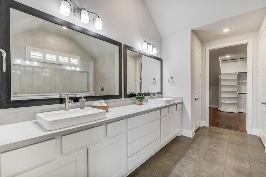 Vanity area has both drawers and cabinets for storage. Vanity area has both drawers and cabinets for storage.