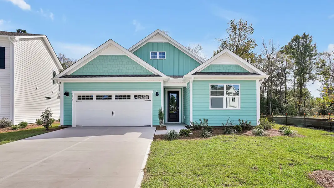 Front exterior of a new home in The Haven at Indigo Preserve, Leland, NC, highlighting curb appeal (Image 1). Front exterior of a new home in The Haven at Indigo Preserve, Leland, NC, highlighting curb appeal (Image 1).
