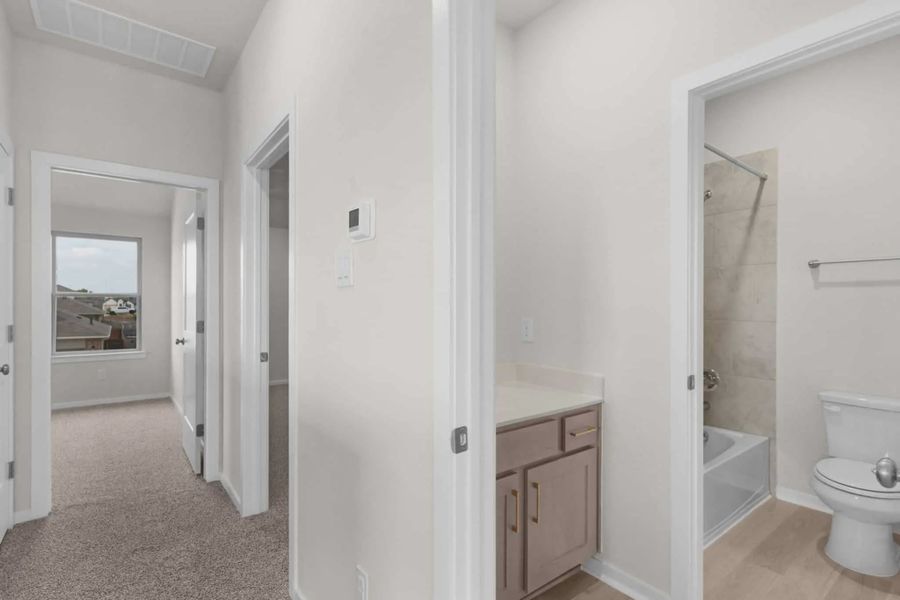 Representative furnished interior of a home built from the Madison by Chesmar Homes in University Heights, McKinney (Image 10).