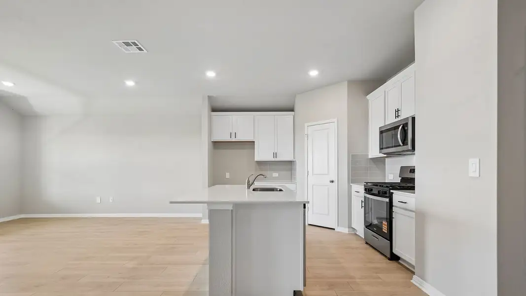 Furnished interior view inside a new home in Carillon, Manor (Image 6).