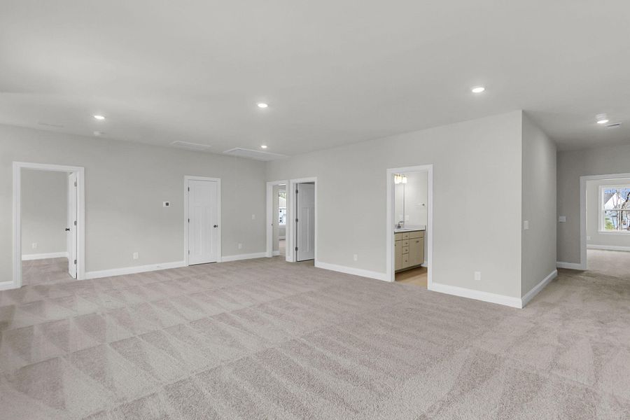 Spacious, unfurnished interior of a new home in Tidewater at Lakes of Cane Bay, Summerville (Image 44).