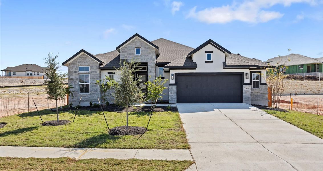 Front exterior of a new home in Highland Village, Georgetown, TX, highlighting curb appeal (Image 25).