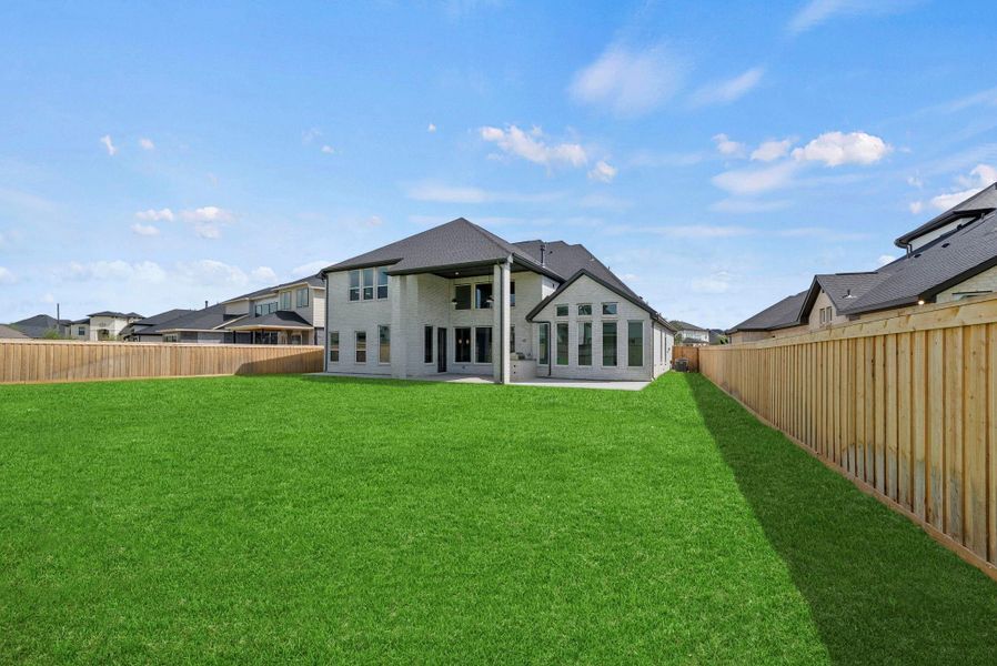 Exterior details and patio area of a home in Dunham Pointe, Cypress (Image 4).