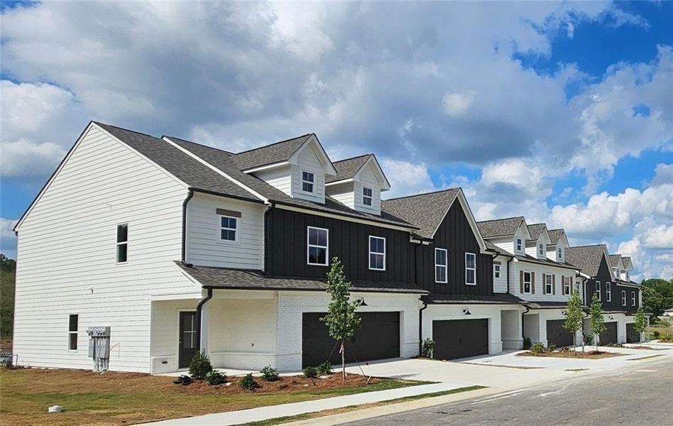 Front exterior of a new home in , Loganville, GA, highlighting curb appeal (Image 22). Front exterior of a new home in , Loganville, GA, highlighting curb appeal (Image 22).
