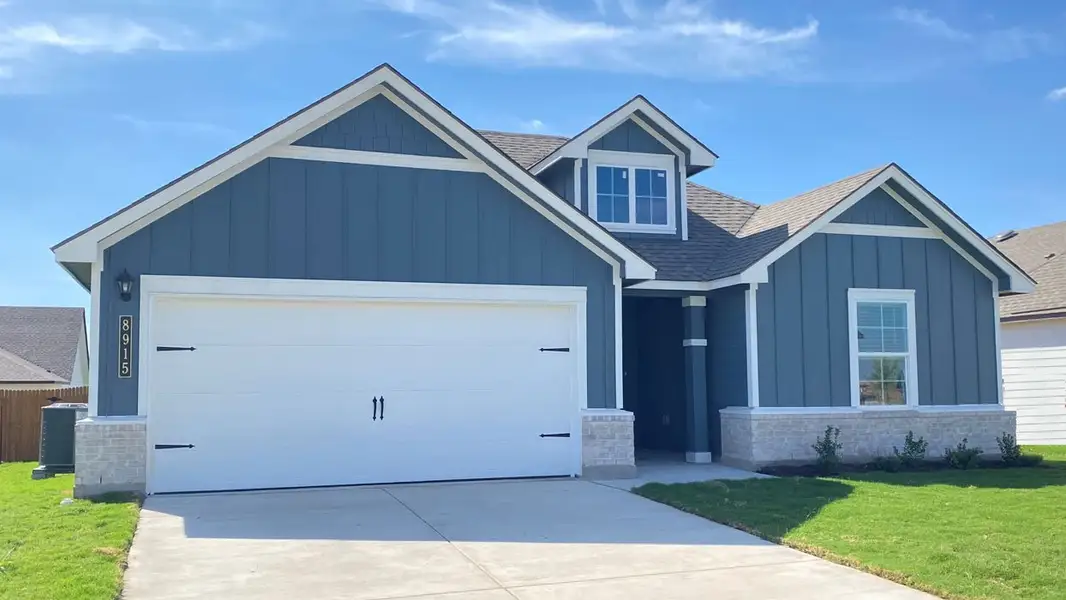 Front exterior of a new home in Mesa Ridge, Temple, TX, highlighting curb appeal (Image 2).