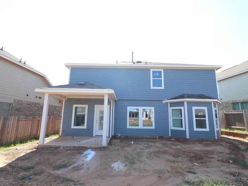 Front exterior of a new home in Magnolia Ridge, Magnolia, TX, highlighting curb appeal (Image 14). Front exterior of a new home in Magnolia Ridge, Magnolia, TX, highlighting curb appeal (Image 14).