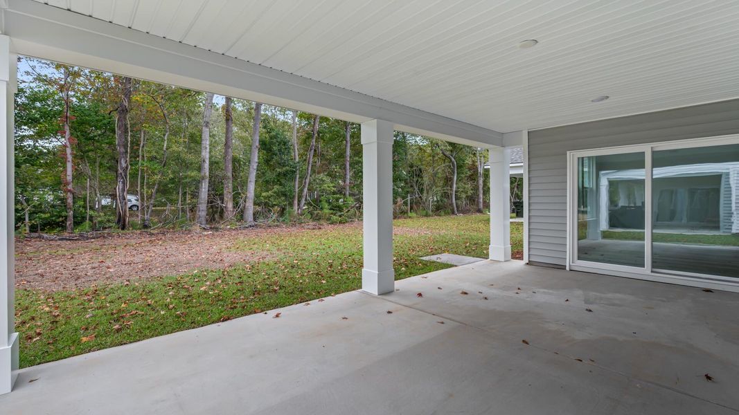 Exterior details and patio area of a home in Creekside at Andrews, Summerville (Image 3). Exterior details and patio area of a home in Creekside at Andrews, Summerville (Image 3).