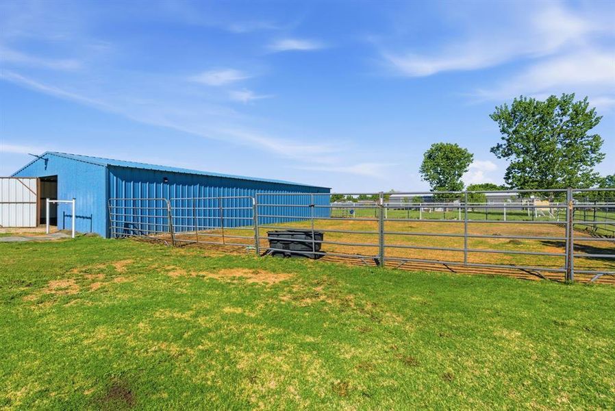 View of yard with an outdoor structure and an exterior structure View of yard with an outdoor structure and an exterior structure